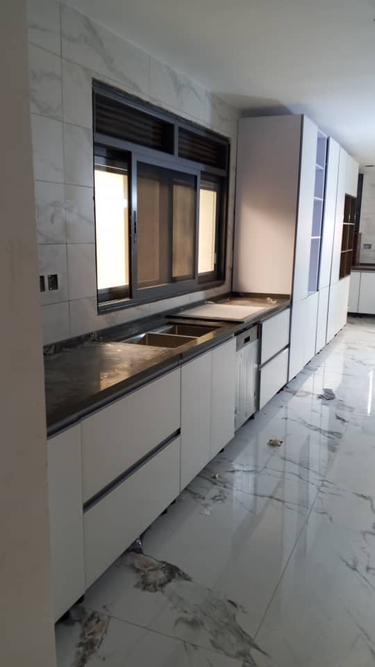 Modern Kitchen Cabinet Set with Black Countertop and Window