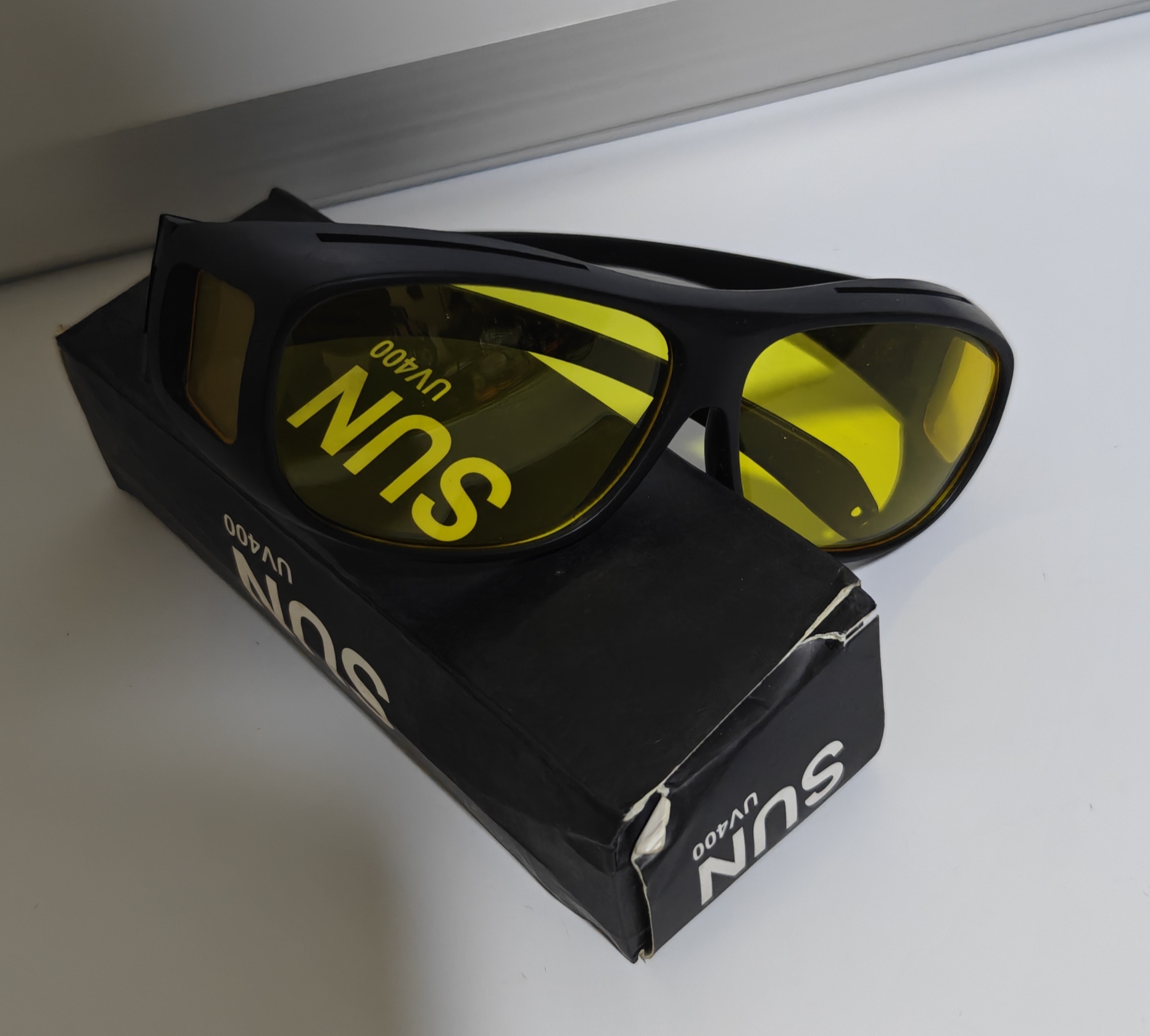 Sunglasses with Yellow Lenses and Black Frame